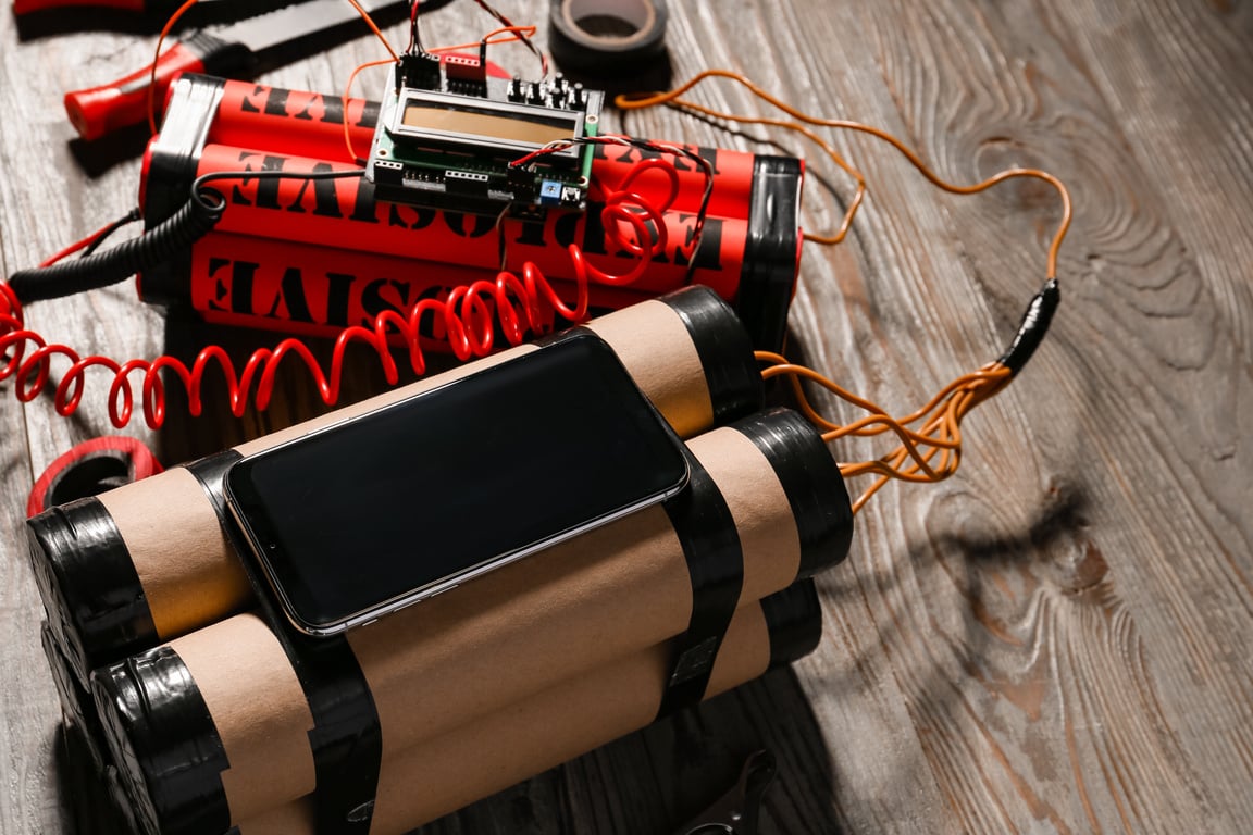 Bomb and Tools on Wooden Background